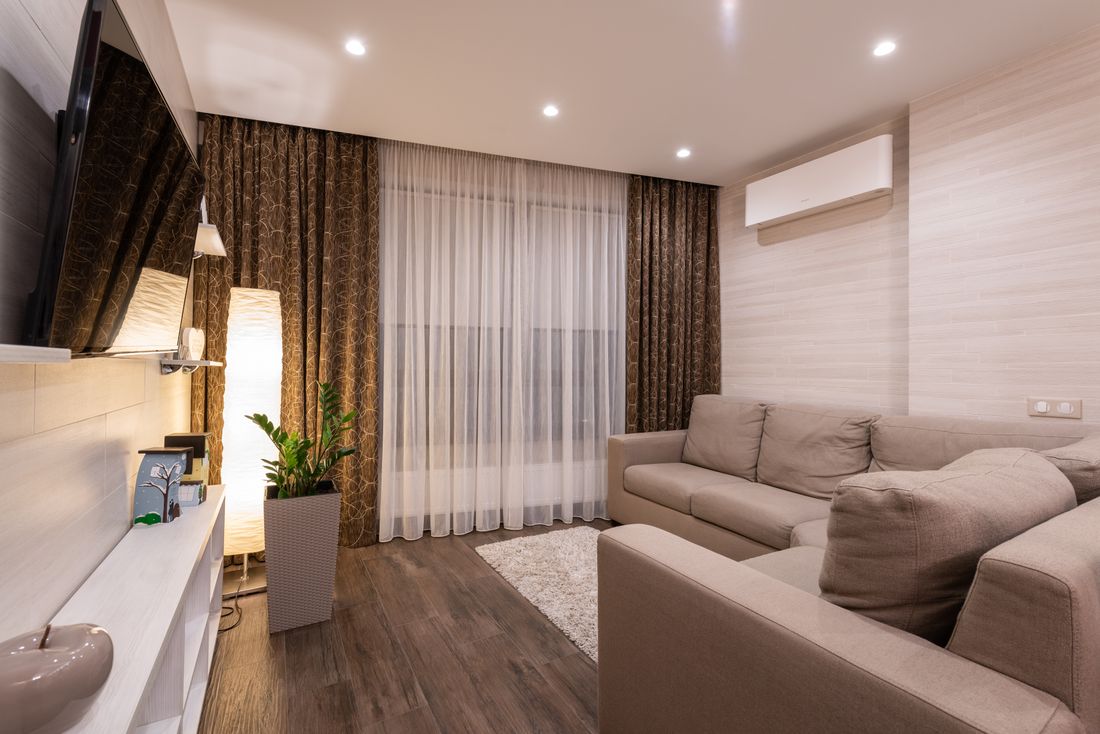 A wall-mounted AC unit in a Dubai rental apartment